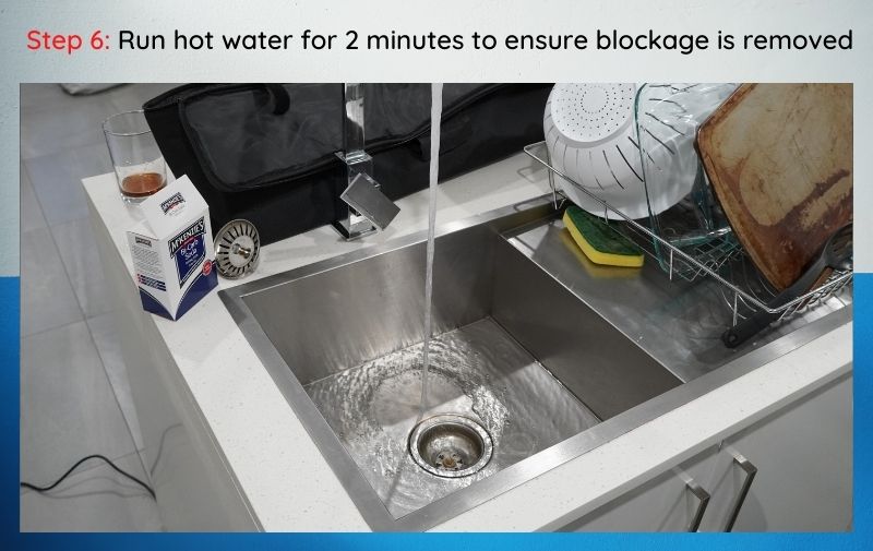 flush a sink with hot water