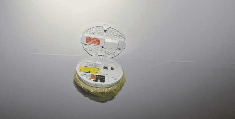 open smoke alarm showing backup battery